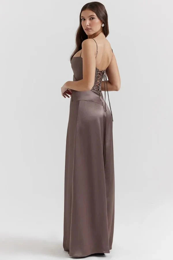 Kouvr Gabriella Gown in Mocha: a brown satin corset maxi dress with a lace-up back, worn by a model.