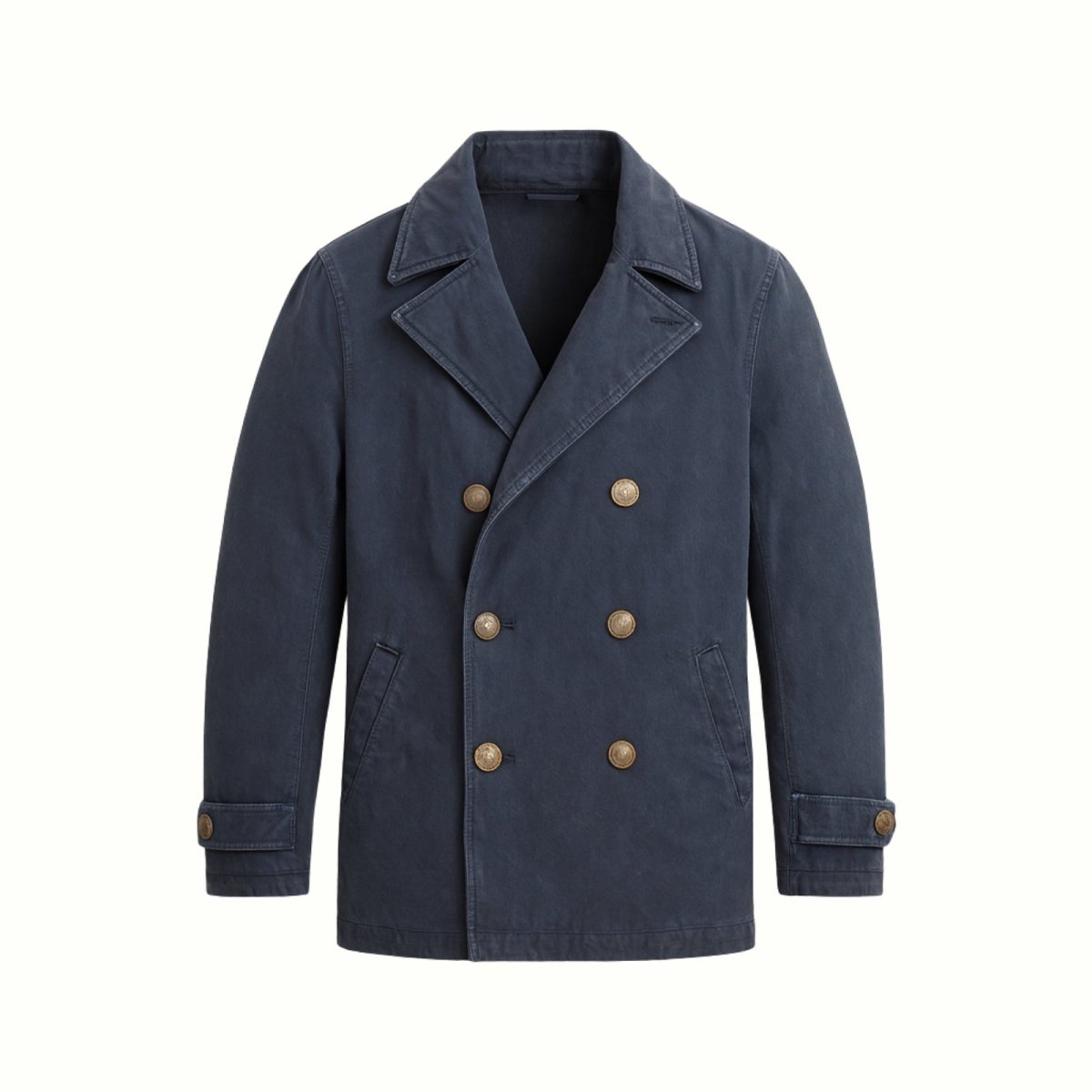 Flat lay of the Kouvr double-breasted cotton peacoat in navy, highlighting the antique brass buttons, wide lapel, and pocket details.