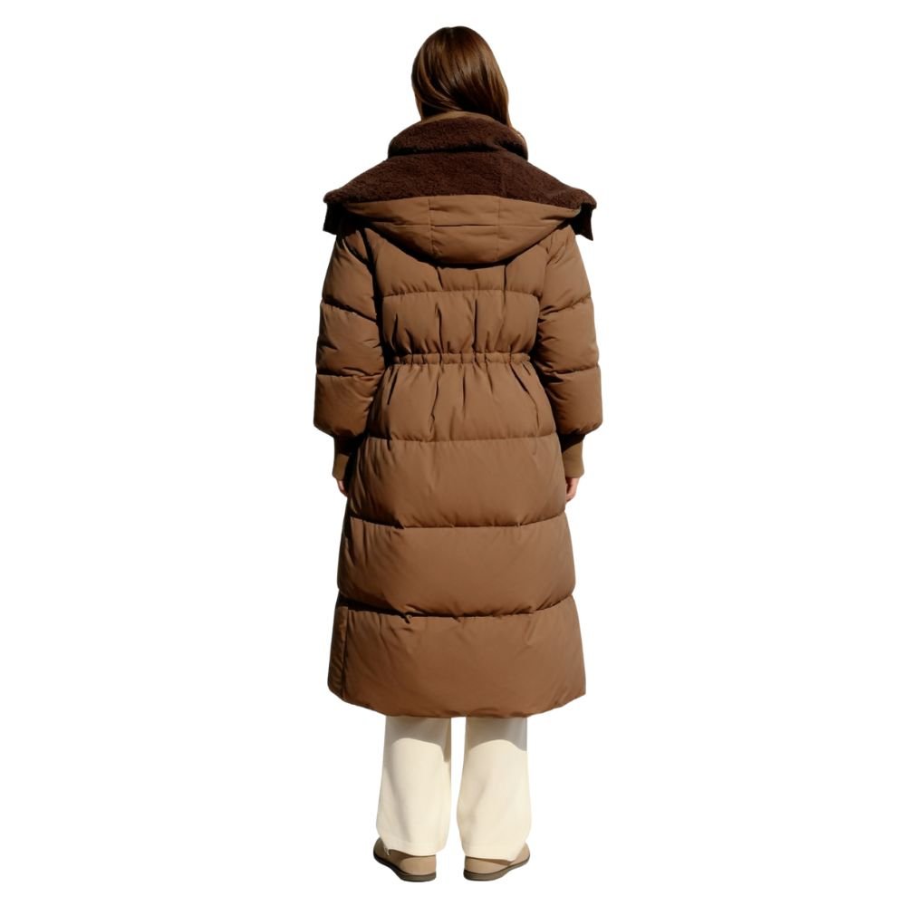 Model wearing the Kouvr Irish long puffer coat in khaki, front view