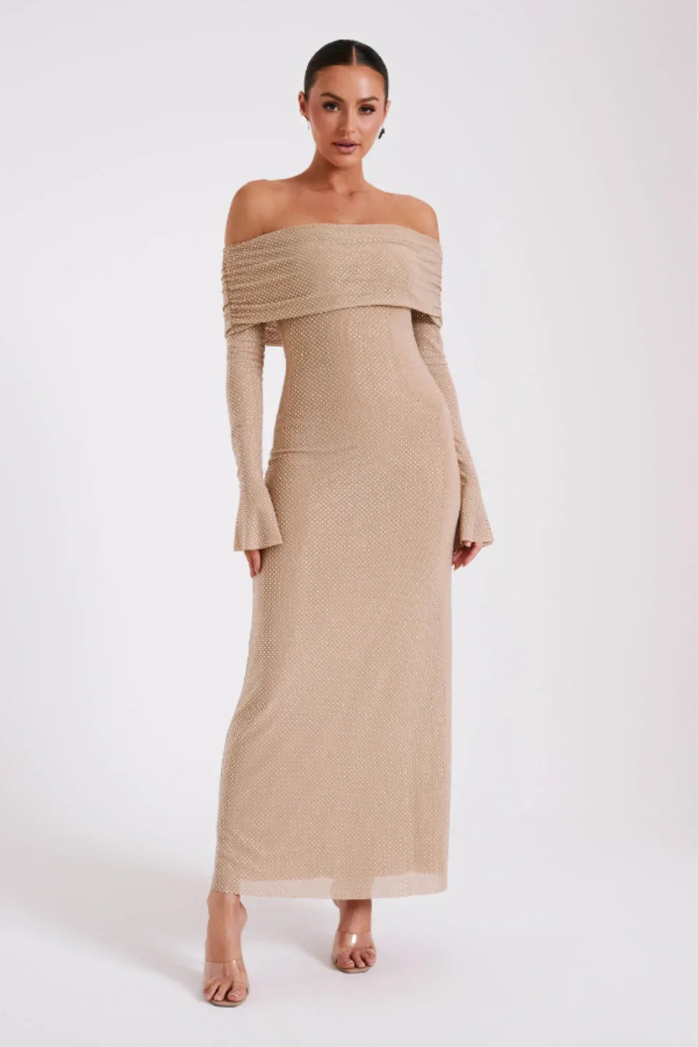 Model from behind in Kouvr Jada Beige off-the-shoulder formal gown with flare sleeves
