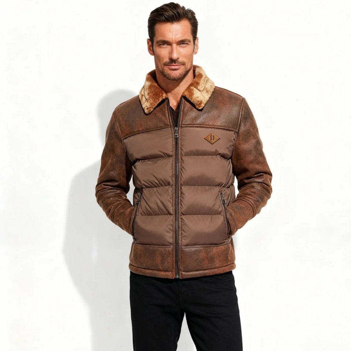 Man wearing a brown Kouvr puffer jacket with fur collar on a white background