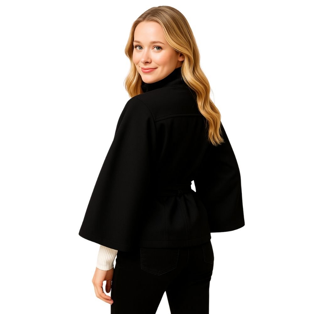 Model wearing the black Kouvr Jaye Cape Jacket, showcasing the tie-back belt and wide kimono sleeves