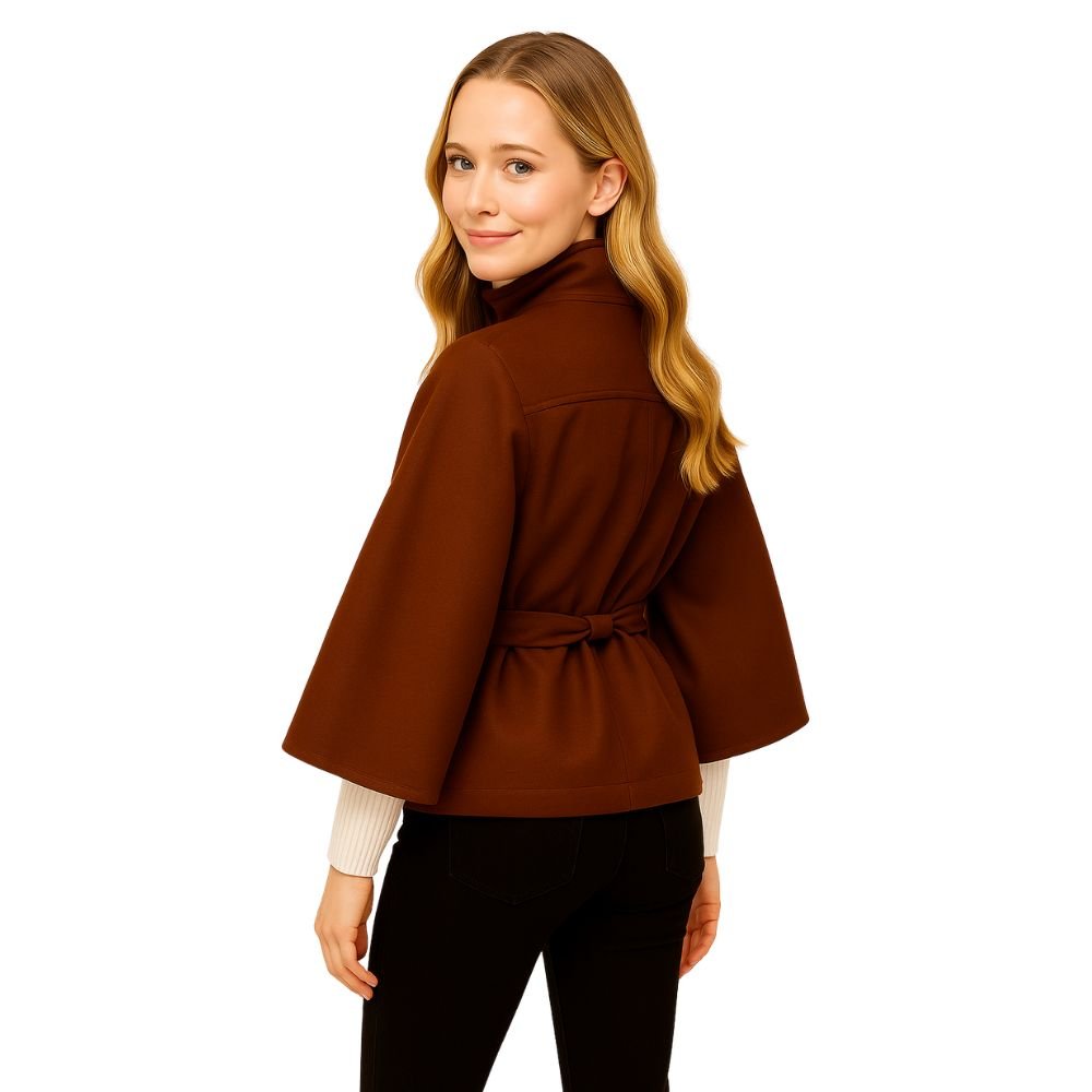 Model from the back wearing the Kouvr Jaye Belted Cape Jacket in Brown, showcasing the wide sleeves and tie-waist detail