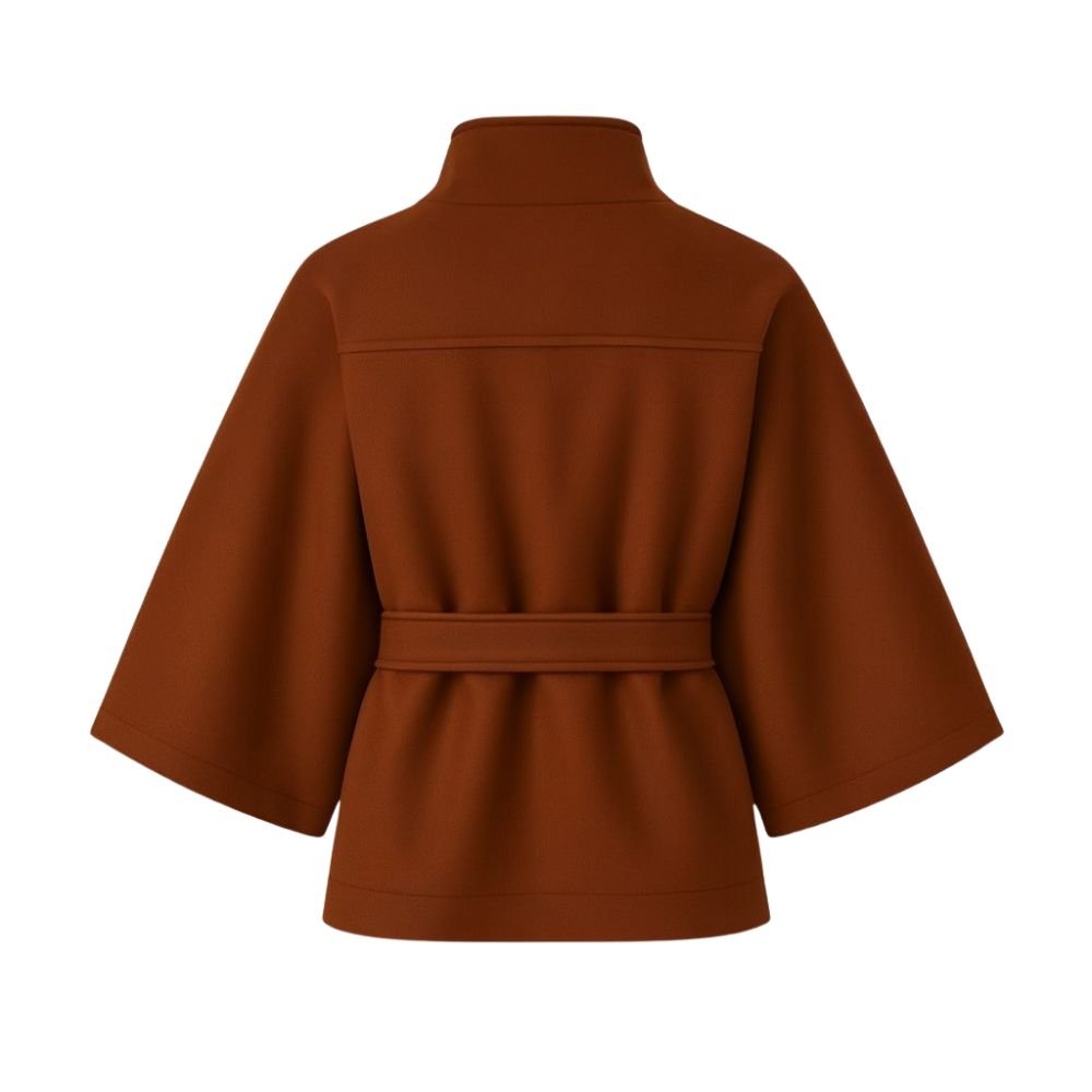 Model from the back wearing the Kouvr Jaye Belted Cape Jacket in Brown, showcasing the wide sleeves and tie-waist detail