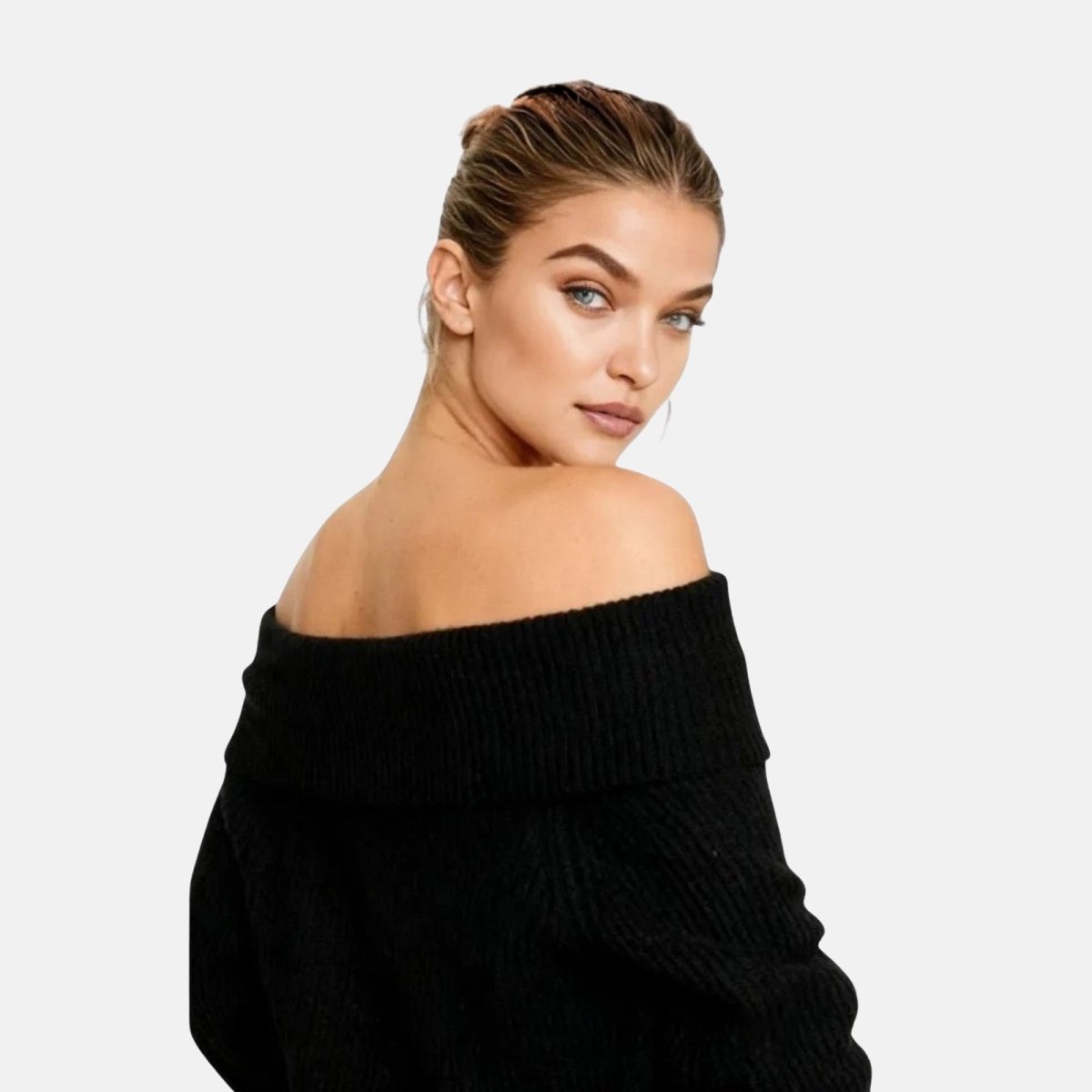 Woman wearing a black off-shoulder sweater on a light gray background