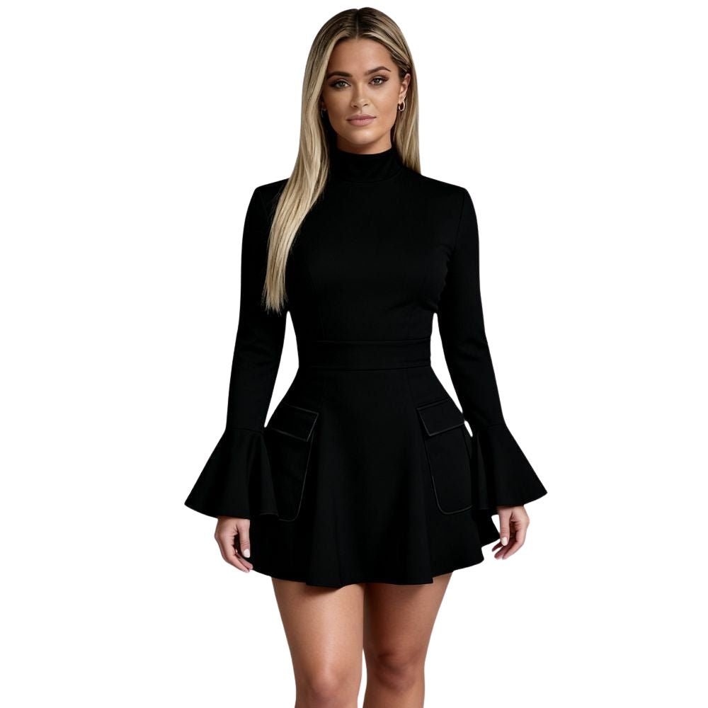 Woman wearing Kouvr Kaisha black long sleeve open-back mini dress in a stone archway