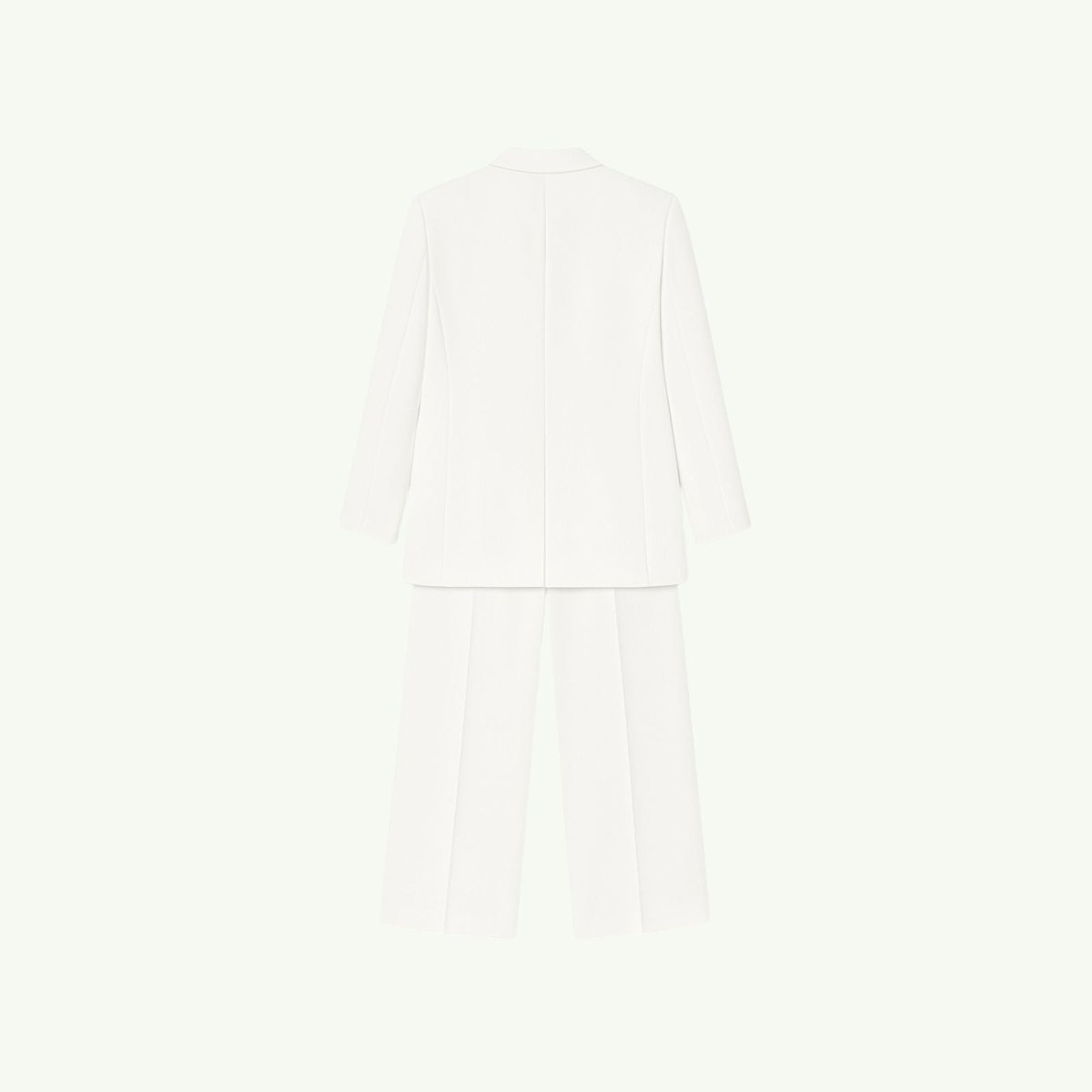 Back view flatlay of the Kouvr Kate white suit, detailing the construction of the blazer and trousers from the back.