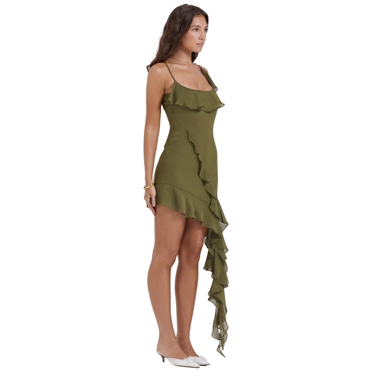 Woman wearing a olive kouvr dress with ruffled details on a white background