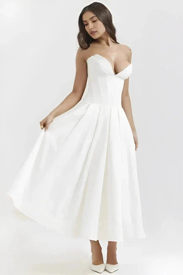 structured bustier dress, tea-length bridal dress, sculpted bodice, architectural silhouette, and modern occasion wear