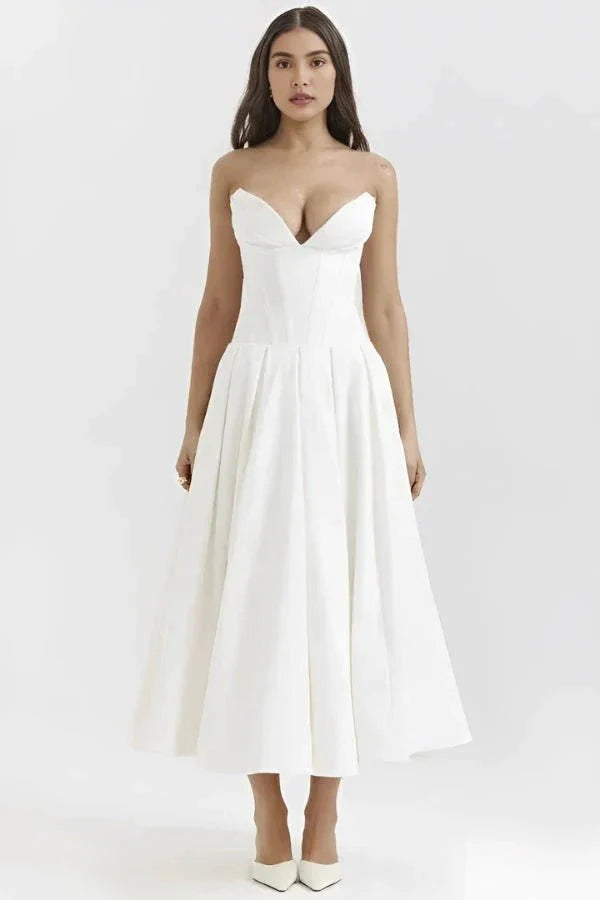 structured bustier dress, tea-length bridal dress, sculpted bodice, architectural silhouette, and modern occasion wear