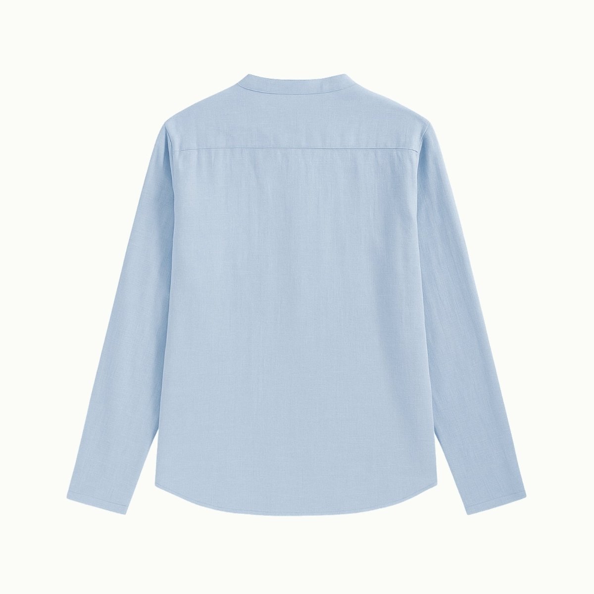 Back view flat lay of the Kouvr band collar shirt in light blue, showing the construction of the yoke and the premium linen material.