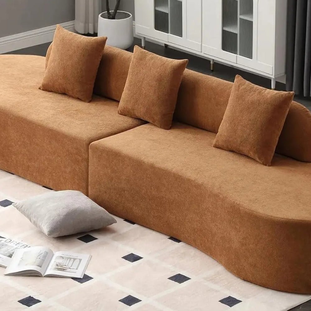 luxe couch," "minimalist sofa," "low-profile sectional," "bouclé fabric sofa," "cloud sofa alternative," and "statement living room furniture