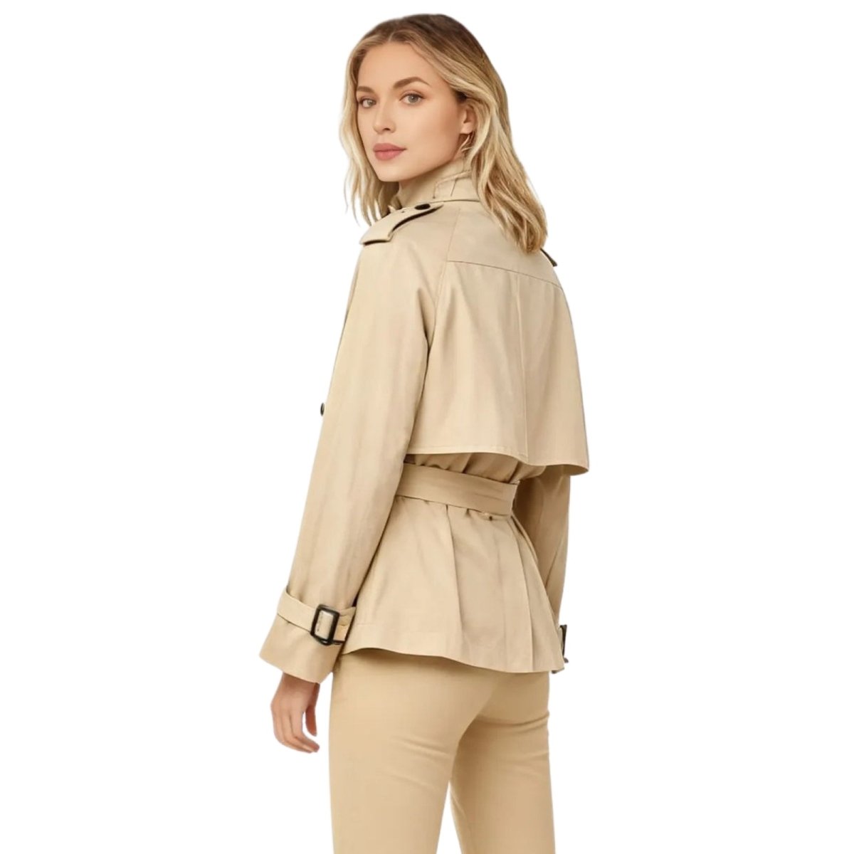 Woman wearing a beige Kouvr trench coat and pants on a white background