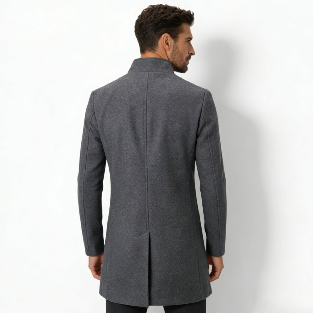 Back view of the Kouvr Fashion men's charcoal grey winter coat, showing the structured shoulders and single vent detail.