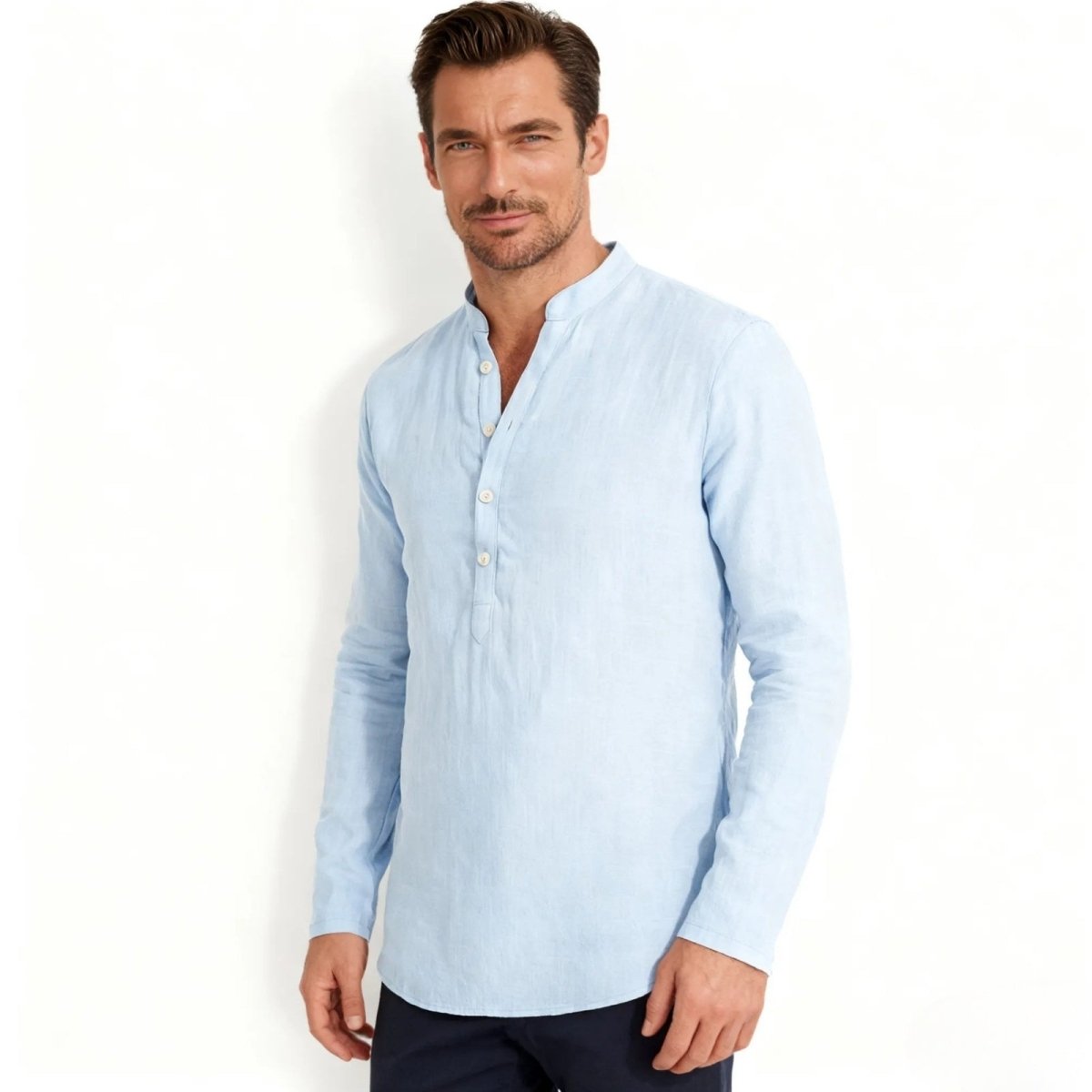 Model wearing the Kouvr men's light blue long sleeve linen band collar shirt, showing the Henley placket and relaxed fit.
