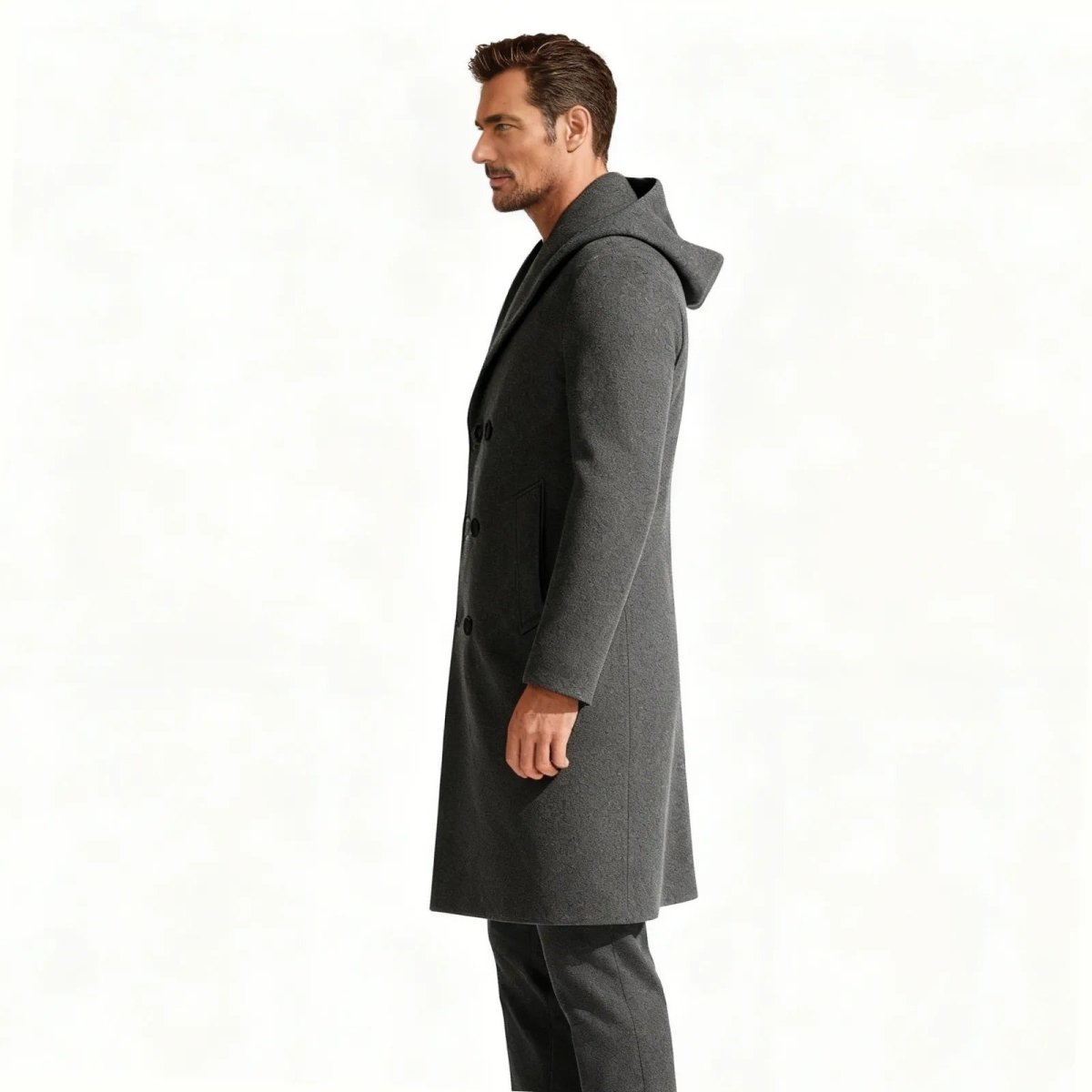 Side view of a man in a modern urban pea coat with a hood, showing the slim silhouette and pocket detail.