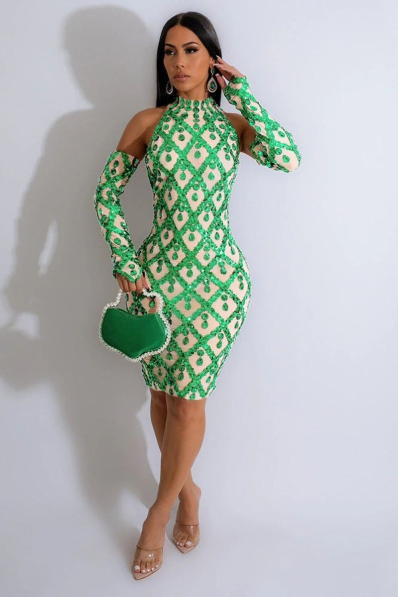 Model wearing Kouvr's Myra green crystal embellished long sleeve dress with cold shoulder cut-outs and an open back