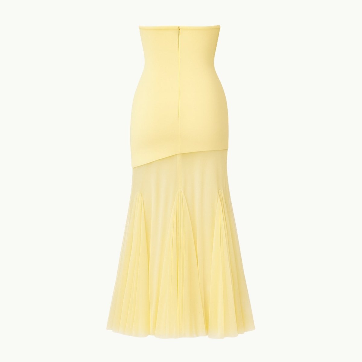 Yellow dress with a pleated skirt on a white background