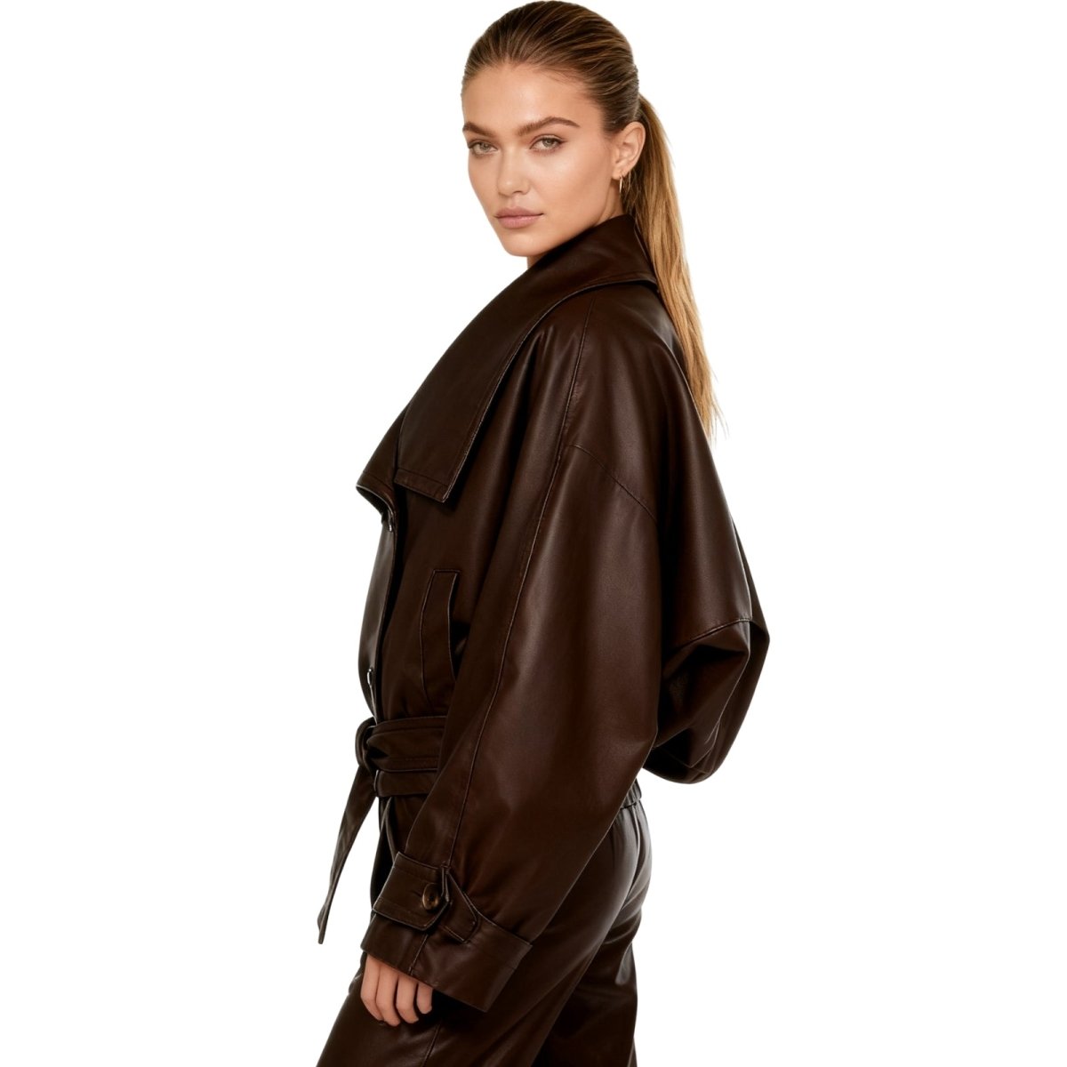 Model wearing the Kouvr Patricia oversized faux leather cropped trench jacket in dark brown