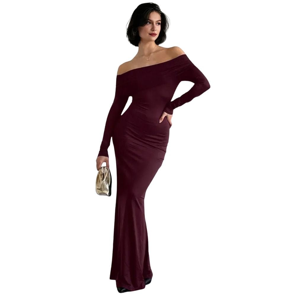 Woman wearing a burgundy kouvr off-shoulder gown on a white background