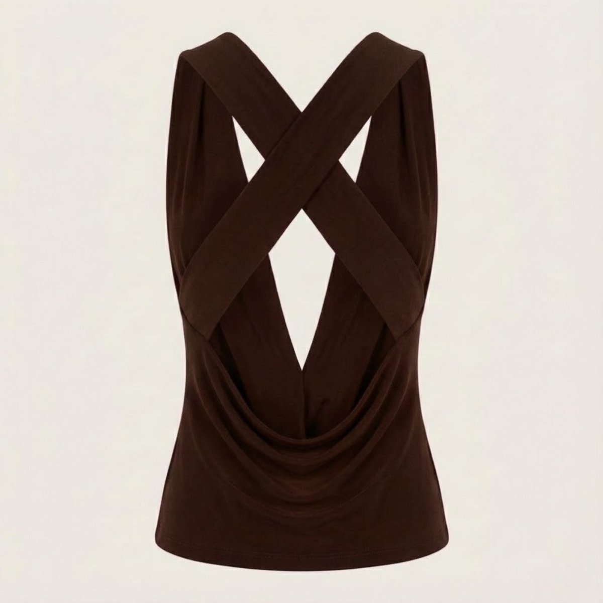 Flat lay of the back of the Kouvr Rhea top, detailing the structured criss-cross straps and open back design.