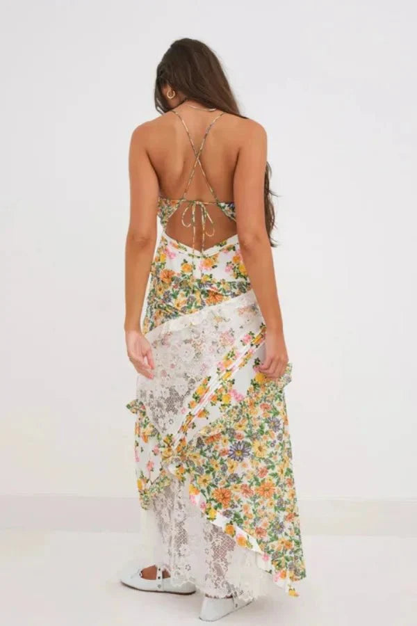 Model wearing Kouvr Fashion floral and lace maxi dress with open back