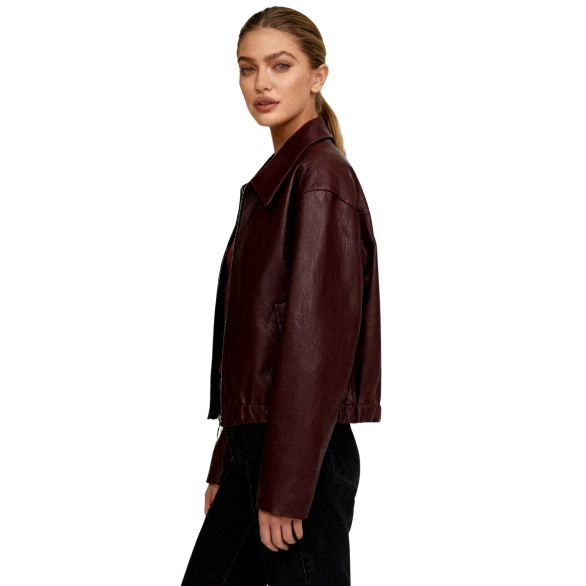 Woman wearing a burgundy Kouvr leather jacket on a white background