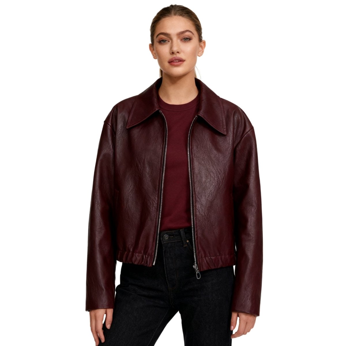 Woman wearing a burgundy Kouvr leather jacket on a white background