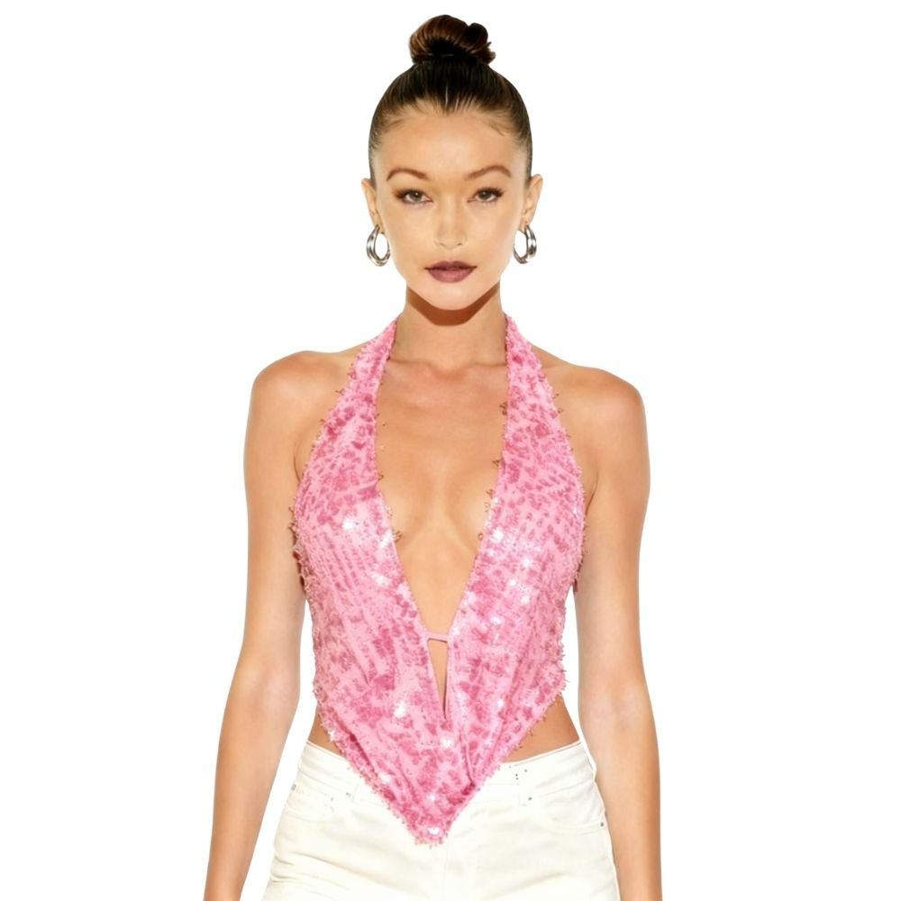 Woman wearing a pink kouvr sequin halter top on a white background