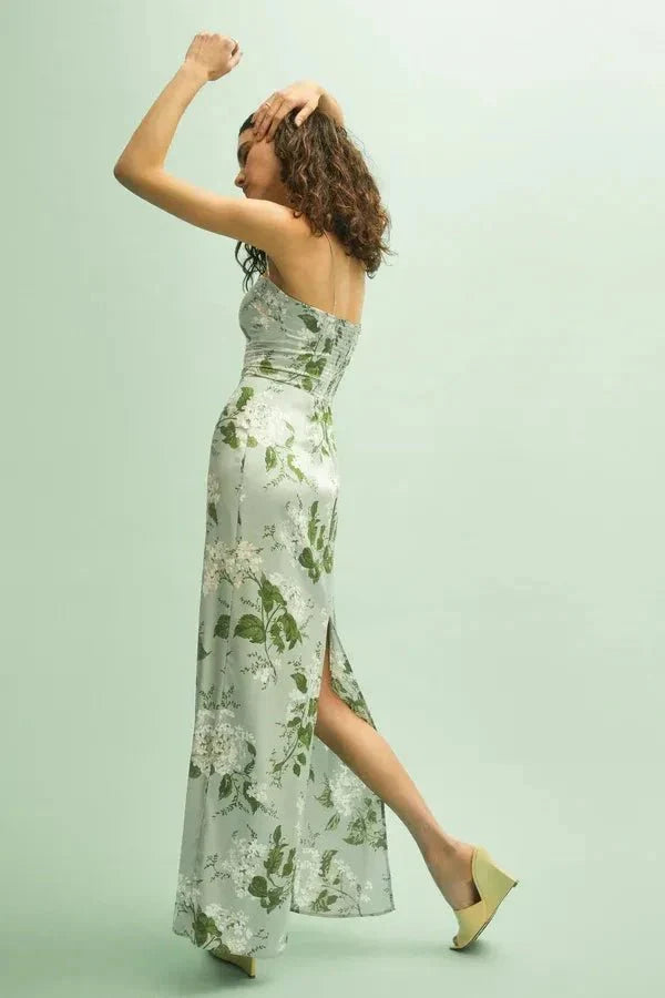 Model wearing the Kouvr Fashion Sage Green Silk Maxi Dress at an outdoor event