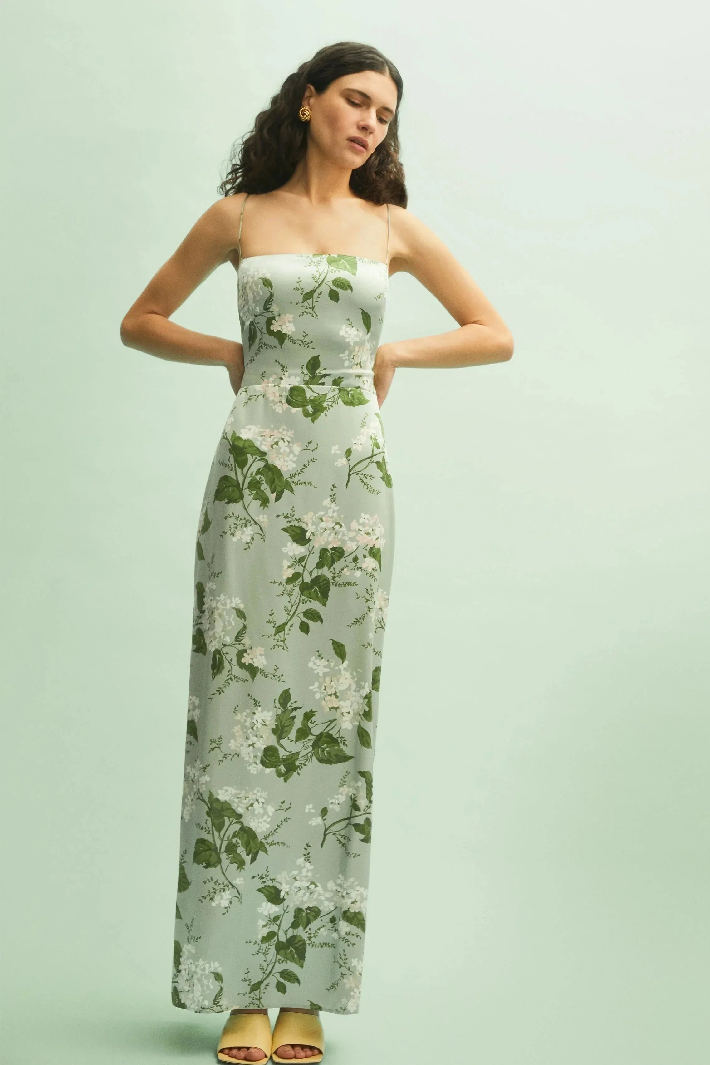Model wearing the Kouvr Fashion Sage Green Silk Maxi Dress at an outdoor event