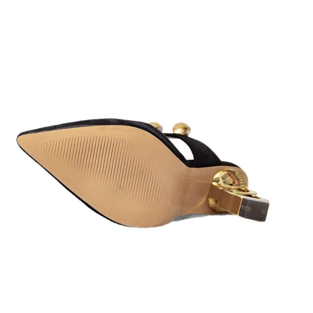 Side profile of Kouvr Sculptural Chain Heel Mules in Black Suede