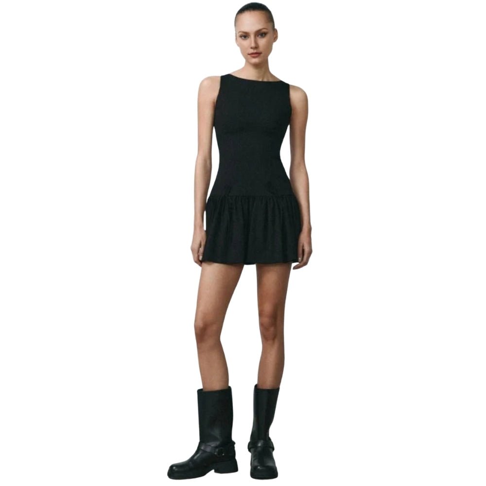 Black Kouvr sleeveless dress worn by a model on a white background