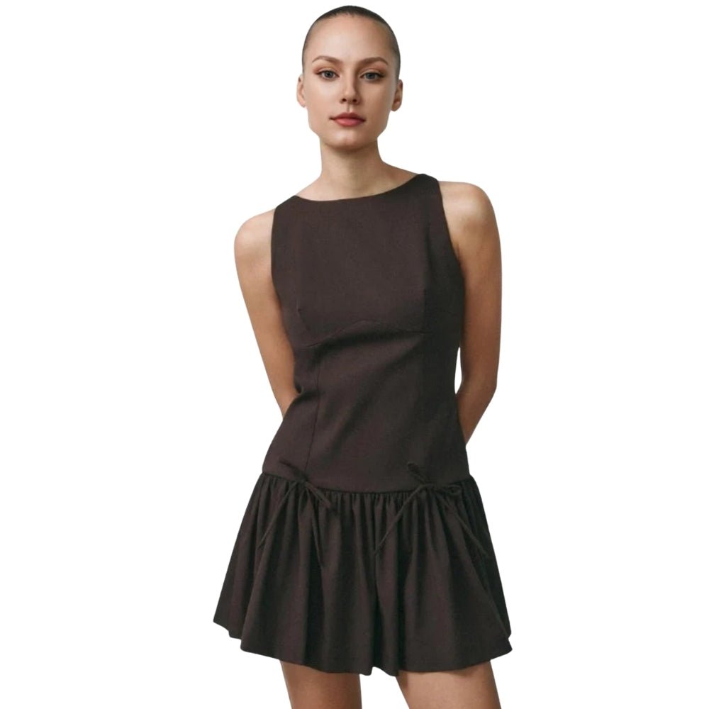 Woman wearing a Brown Kouvr dress on a white background