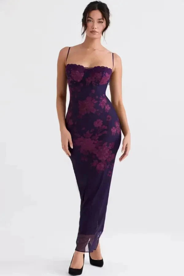 Model wearing Kouvr shaira purple floral corset maxi dress with lace trim for a formal event