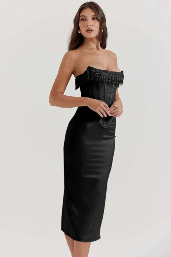Model wearing the Kouvr Sharlene black strapless corset dress with beaded fringe detail