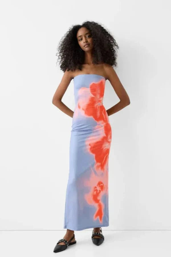 sculpting," "silhouette," "artistic," "vibrant hues," "resort-ready," "evening affair," "statement piece," "stretch-jersey," and "ankle-length