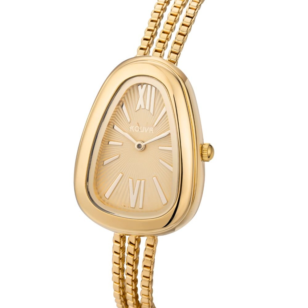 Gold kouvr watch with a white face on a white background