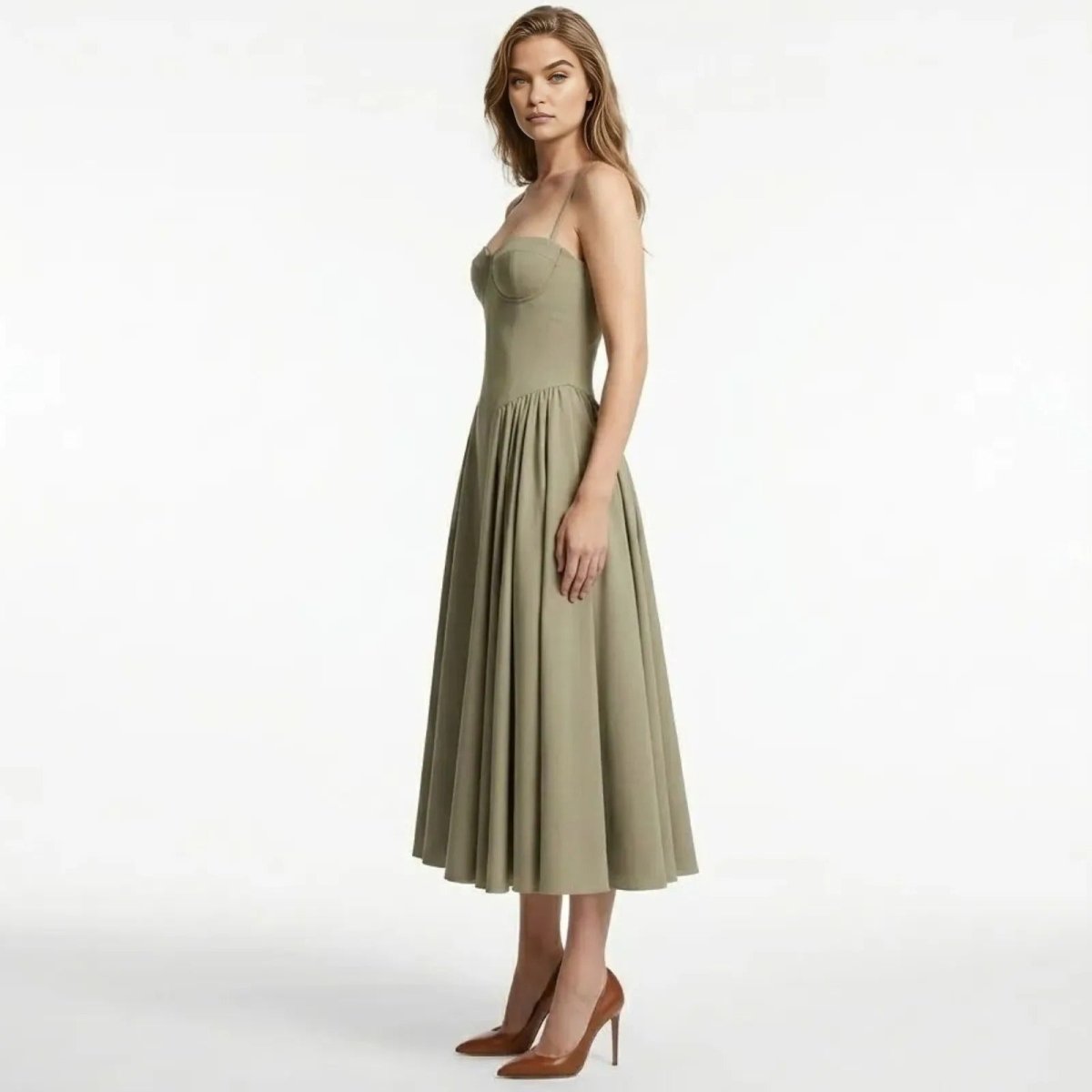 Side view of the Kouvr taupe structured midi dress, highlighting the fit of the corset bodice and the volume of the pleated skirt.