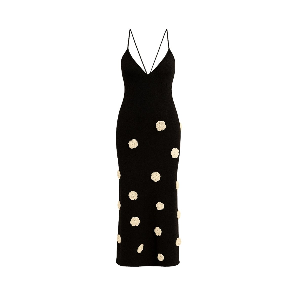 Black kouvr dress with white polka dots on a white background