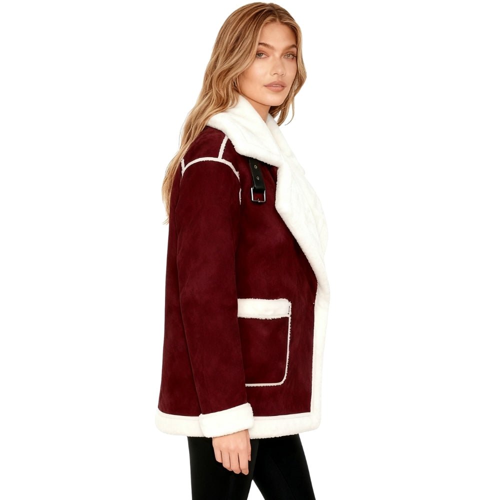 Woman wearing a burgundy Kouvr coat with white fur trim on a white background