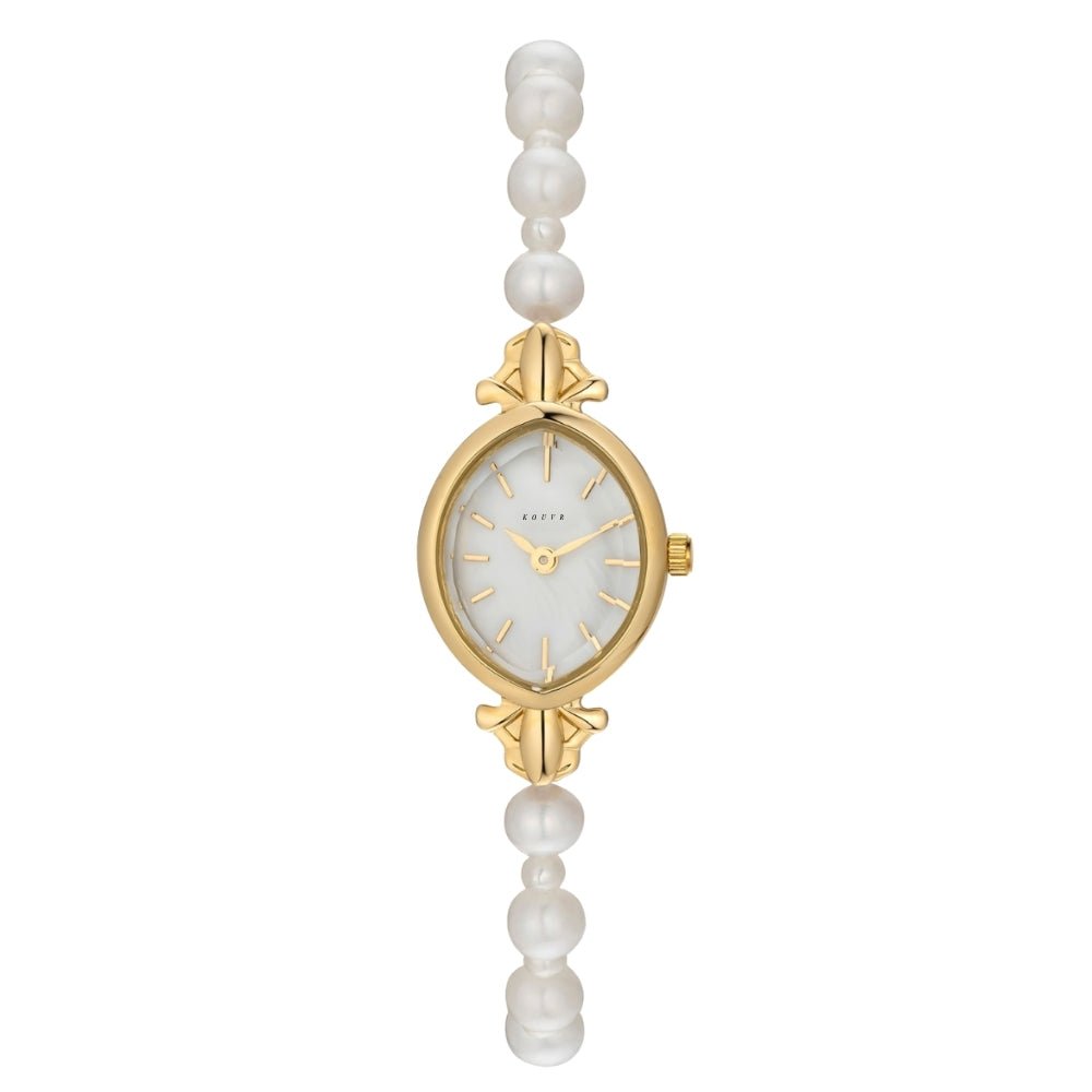 Gold Kouvr watch with pearl-like beads on a white background