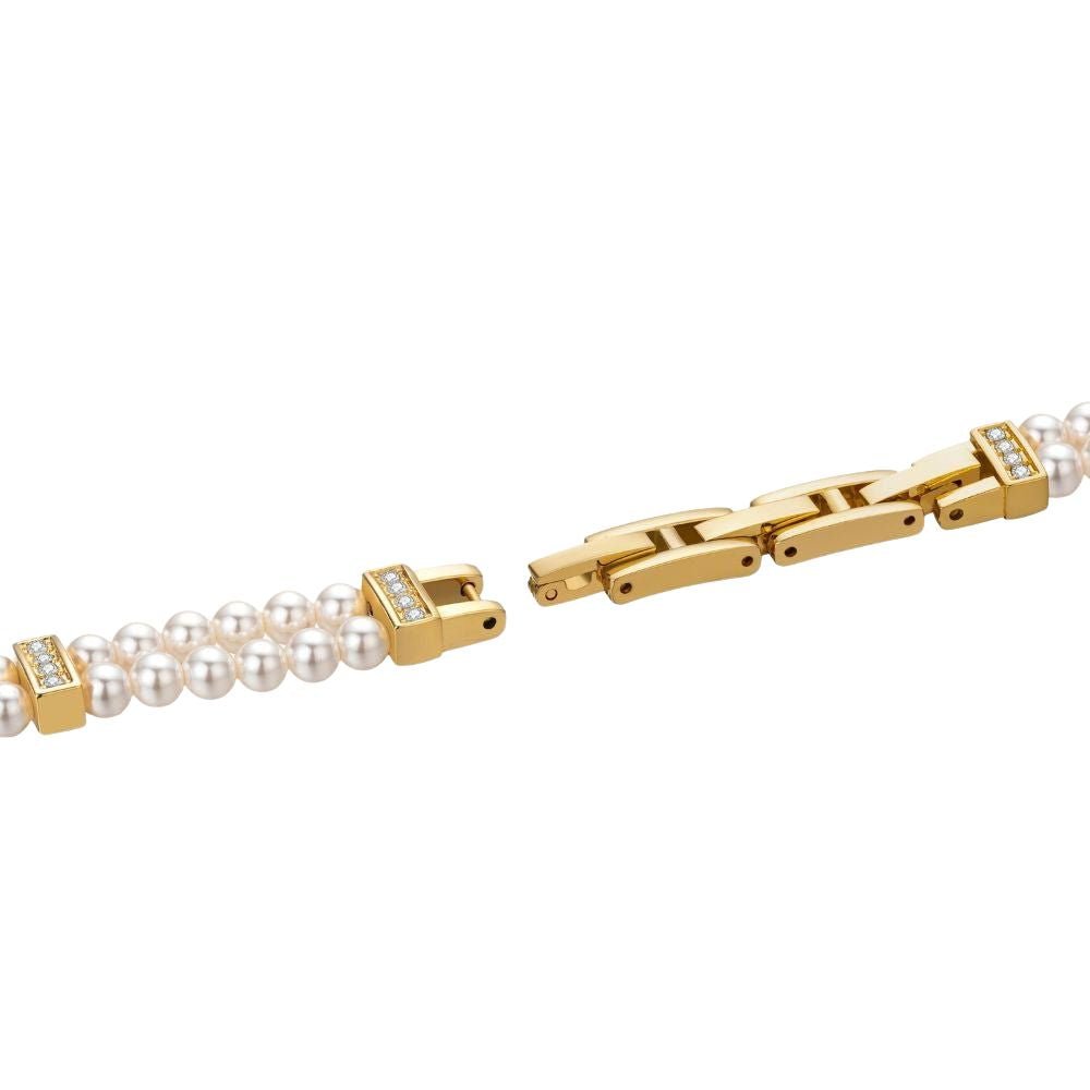 Kouvr women's elegant gold watch with a double strand real pearl bracelet and mother of pearl dial on wrist