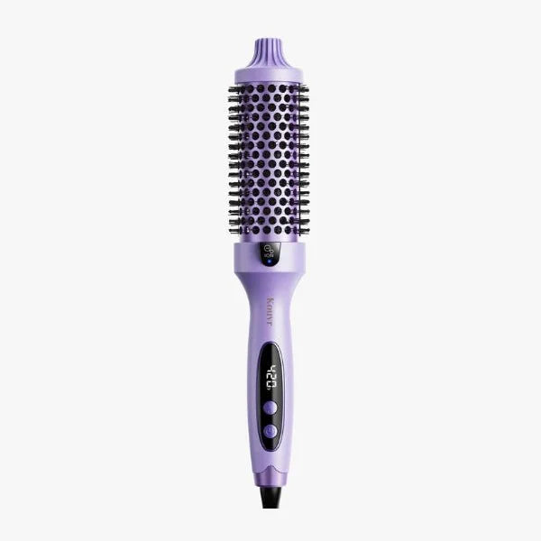 Purple thermal brush by Kouvr with 1.5 inch heated barrel and adjustable heat settings for salon-quality blowouts at home.