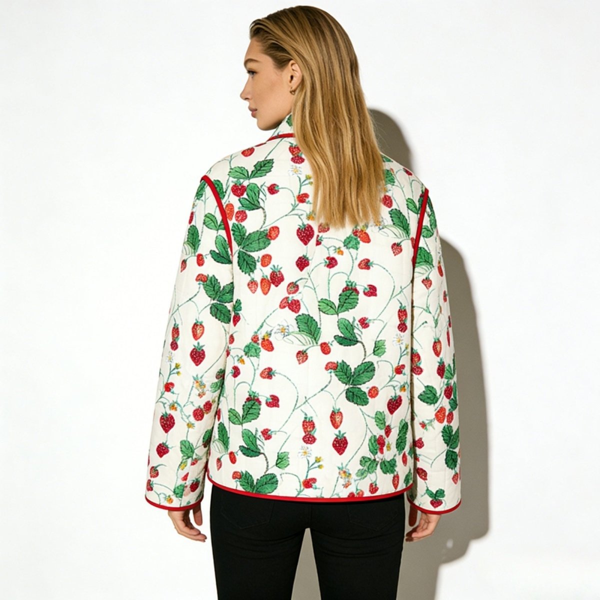 Back view of the Kouvr strawberry garden quilted jacket, displaying the continuous botanical print and silhouette.