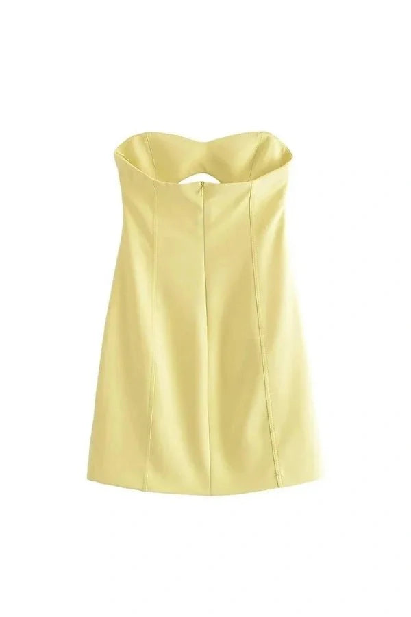 Model wearing the Kouvr Fashion yellow strapless cutout mini dress from the front