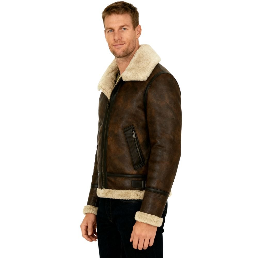 Man wearing a brown kouvr leather jacket with white fur lining on a white background