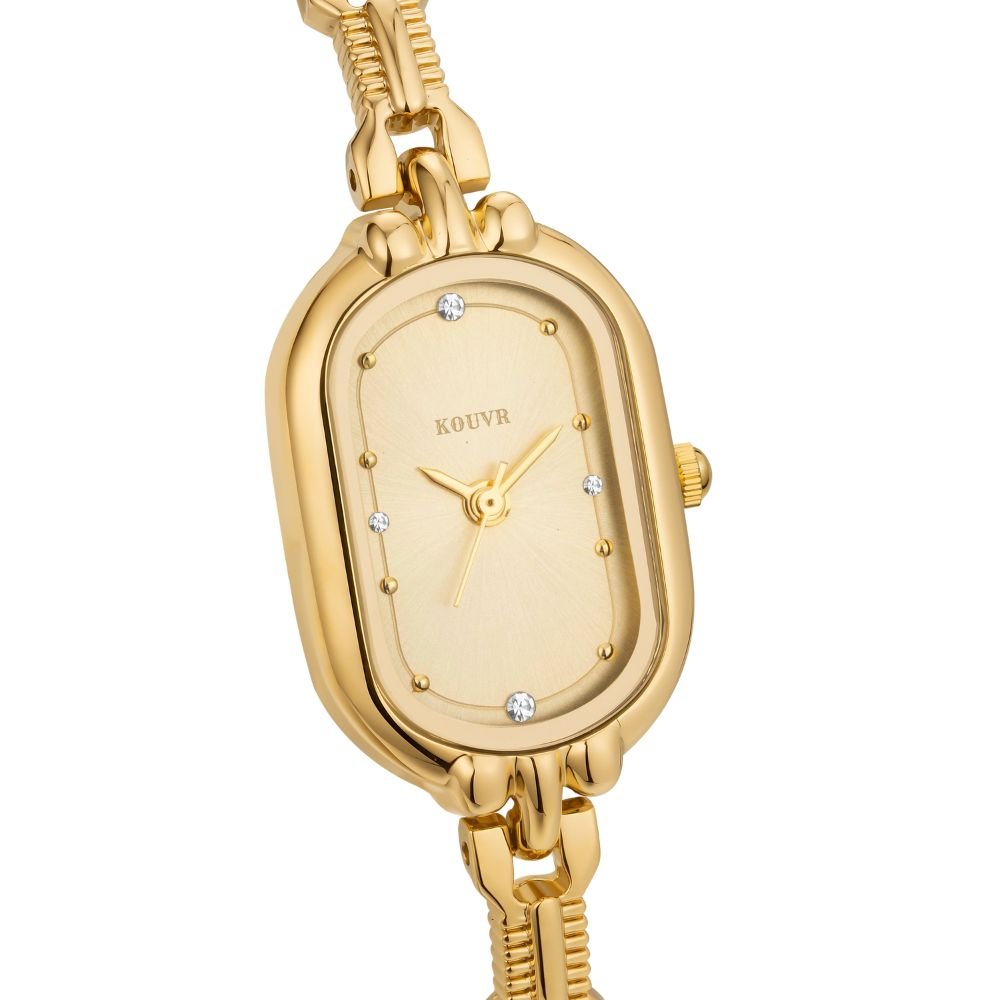 Gold Kouvr watch with a white face on a white background