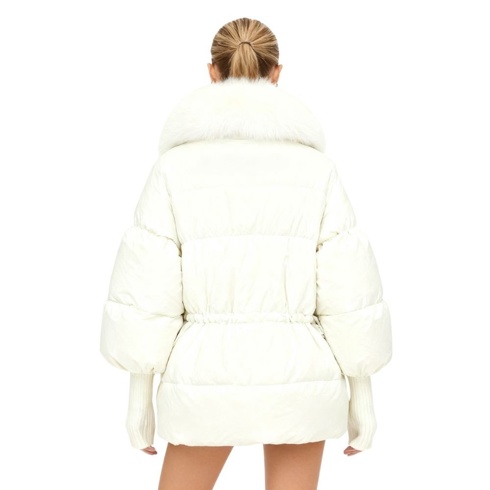Person wearing a white kouvr puffer coat on a white background