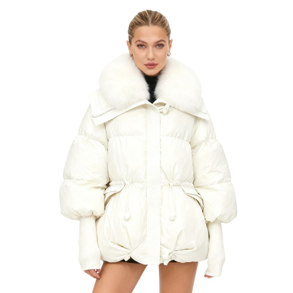 Women wearing a white kouvr winter jacket with fur hood on a white background